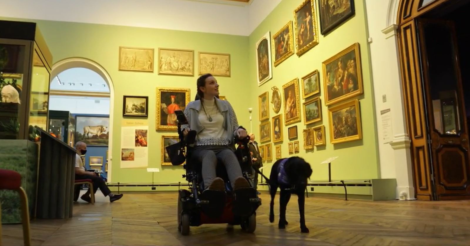 girl in wheelchair in gallery at Bowes Museum